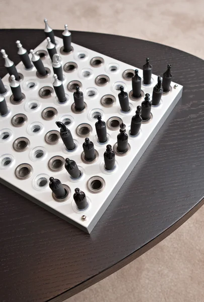 Chess game on a dark wooden table