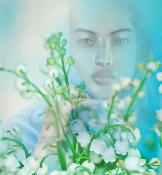Vision or apparition of spiritual woman in a field of flowers.