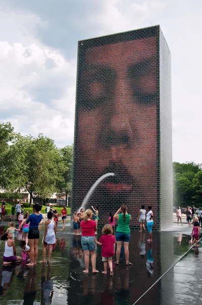 Children playing in the Crown Fountain in Chicago, USA
