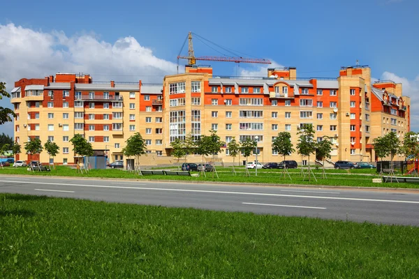 Apartment building, lined with ceramic tile and brick, six-story