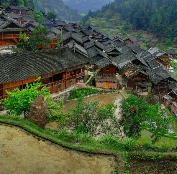 Asian village in mountains China, Farm peasant farming wooden huts.