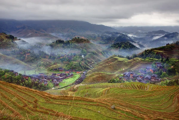 Peasant village in mountainous region of China agricultural, rural landscape.