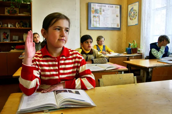 Russian, country school, classroom, schoolgirl raises his hand.