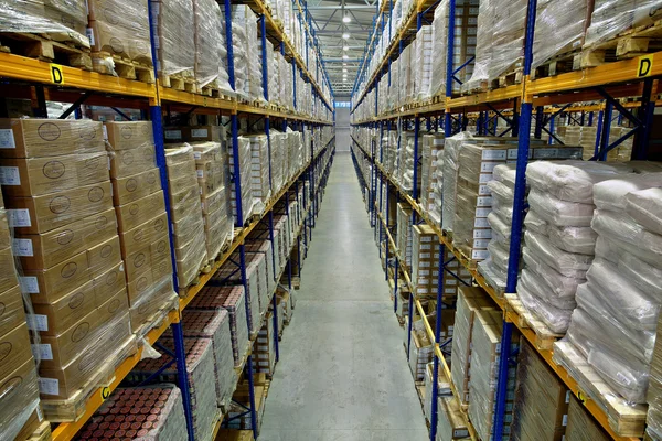 Interior of a large warehouse, with pallet racking