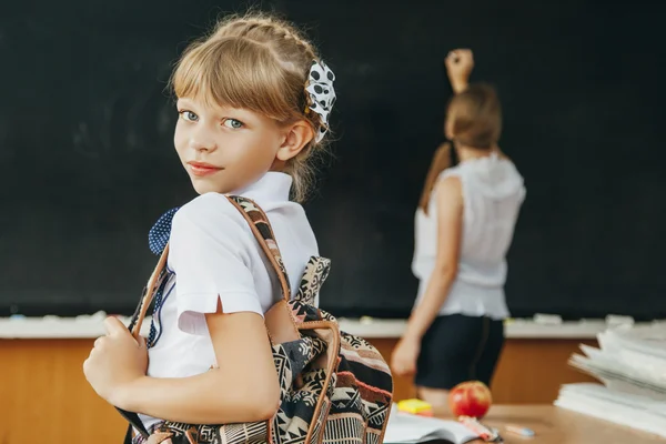 Young girl in classroom. School. fashion