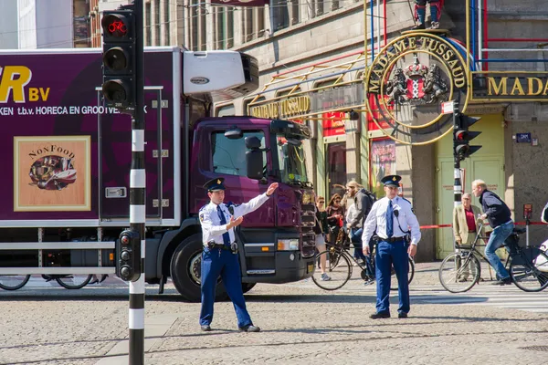 Police officers in Amsterdam giving traffic directions