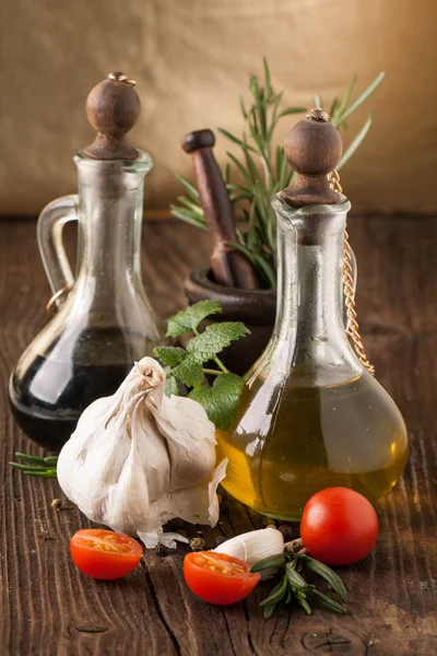 Olive oil and vinegar, gralic, tomatoes with herbs