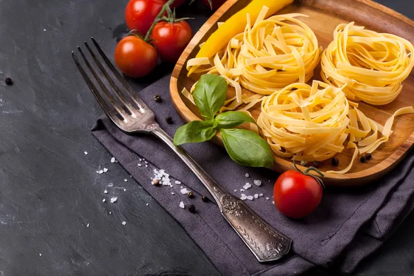 Dry pasta with tomato, basil and pepper