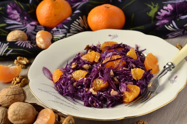 Salad with red cabbage, tangerines and nuts