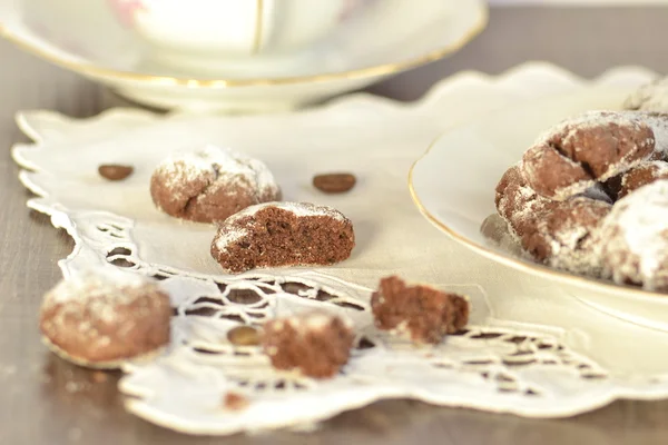 Chocolate Biscuits with icing sugar and tea