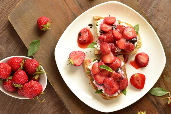 Sandwich with strawberries, cheese and chocolate