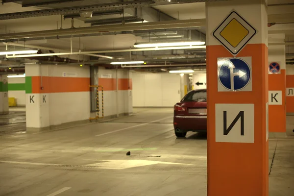 Underground parking with cars.