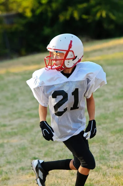 Young football player looking back