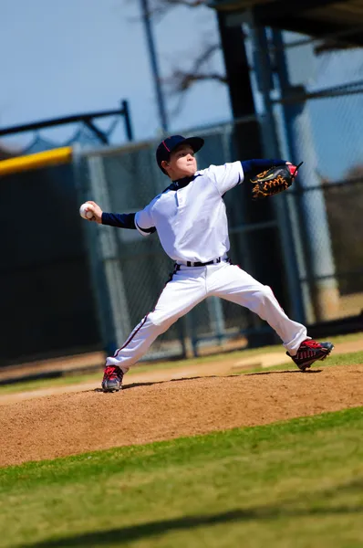 Baseball pitcher throwing ball to the batter