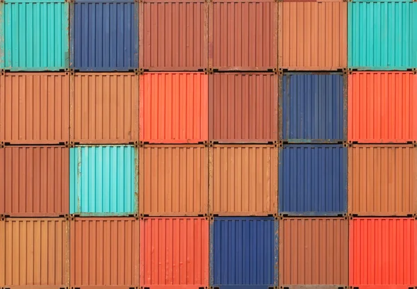 Stack of containers shipping at dockyard