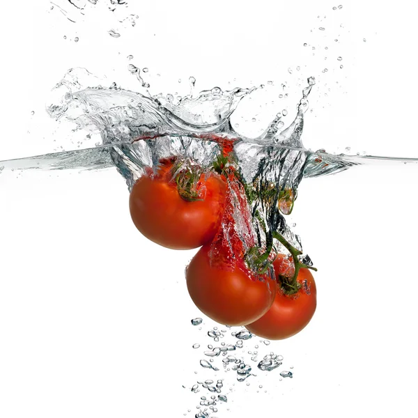 Fresh Red Tomatoes Splash in Water Isolated on White Background