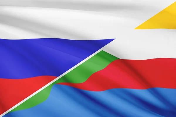 Series of ruffled flags. Russia and Union of the Comoros.