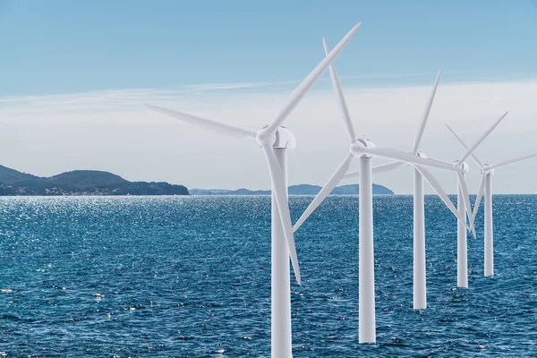White wind turbine generating electricity on the sea