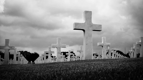 Marble Crosses on a Cemetery in Black and White