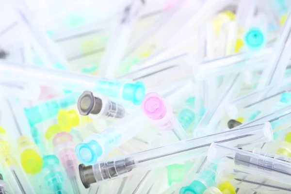 Background from multicolored medical needles.