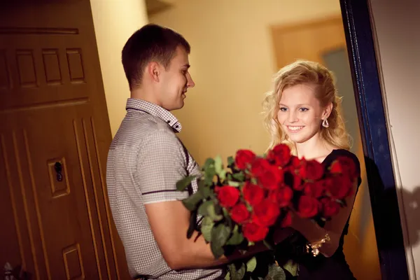 Man gives roses to a girl