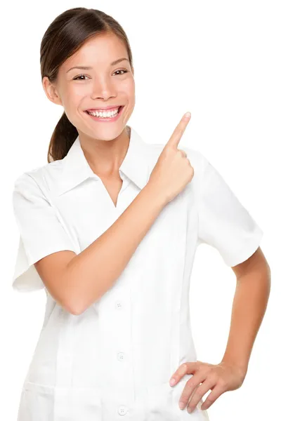 Spa woman employee pointing at white backgroud