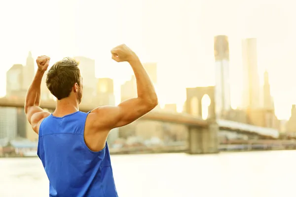 Winning cheering success fitness man in New York