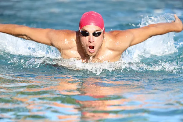 Swimmer athletic man swimming butterfly