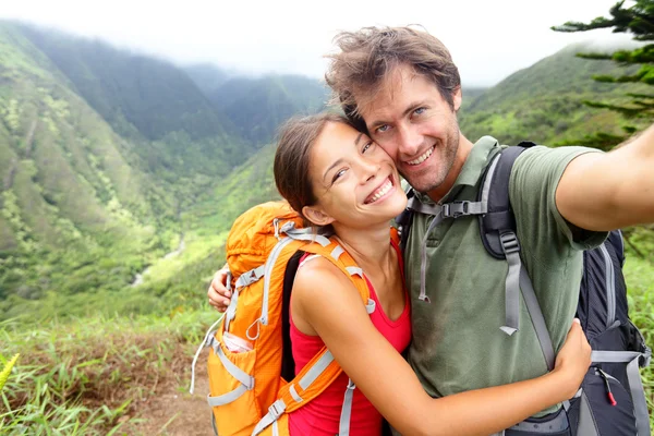 Hiking couple - young couple in love on Hawaii