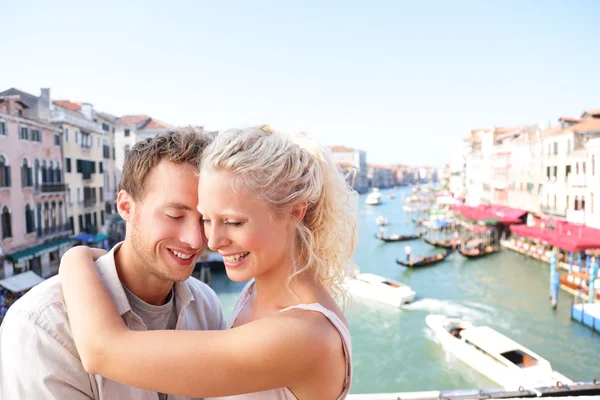 Dating couple hugging and kissing in Venice