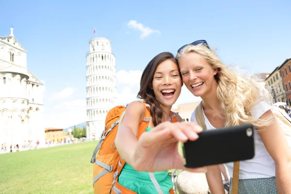 Travel tourists friends taking photo in Pisa