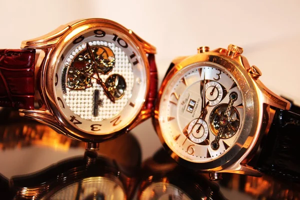 Two golden luxury chronometers (macro)