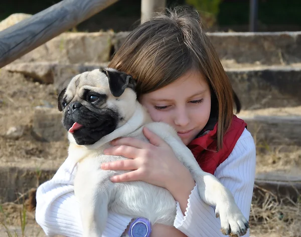 Children with her pug dog
