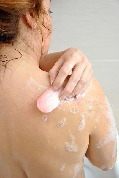 Woman bathing with a lot of foam