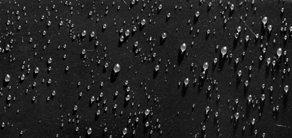 Waterdrops on black surface