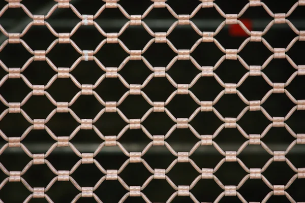 Metallic security net with black background