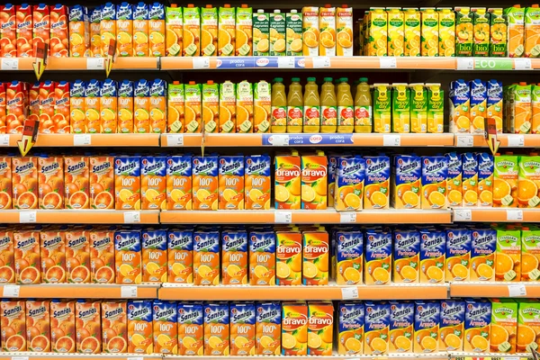 Natural Juice Bottles On Supermarket Stand