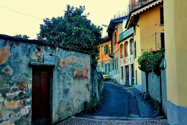 Rivoli. Turin. Italy. homes. roads. courtyards. window. door. lights and streetlights. winter. outdoor. people. walk.