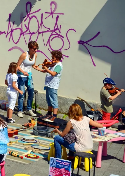 Street party. music lesson. musical instrument. outdoor. people. summer