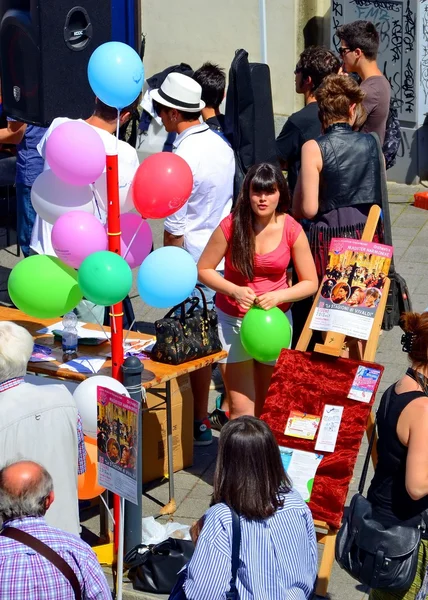 Street party. colorful balloons. outdoor. people. summer