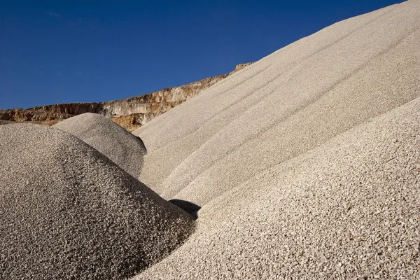 Heaps of stone aggregate for road construction