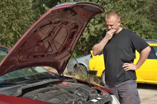 Man repairing the car, helplessness, failure cars