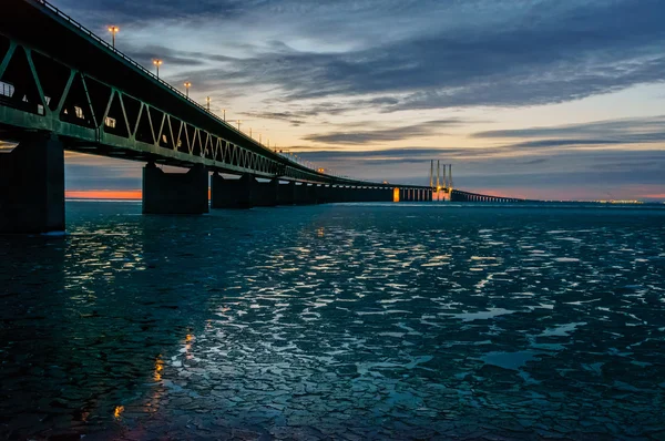 The Øresund Bridge reflected in icy waters