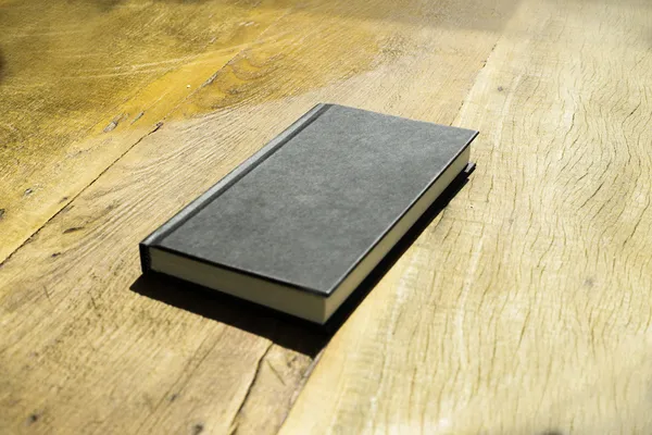Black Book Wooden Table — Stock Photo #38349303