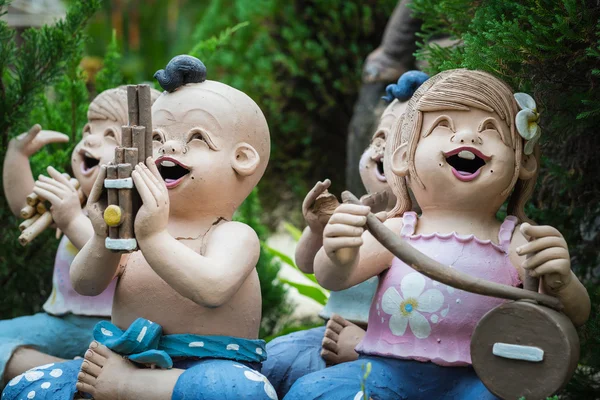 Baked clay dolls in the garden