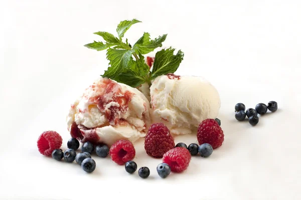Ice cream with fresh raspberries and blueberries