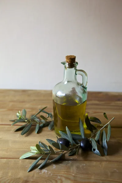 Olives and a bottle of olive oil