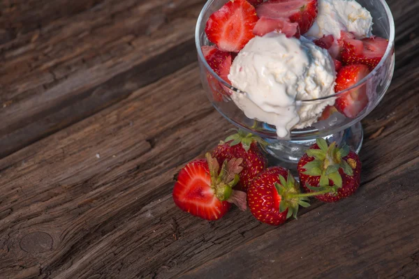 Ice cream with strawberries and whipped cream