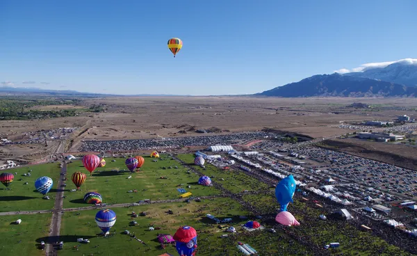 ALBUQUERQUE, NEW MEXICO, USA - OCTOBER 08: A large crowd was on hand for the morning mass ascension of balloons at the 40th edition of the Albuquerque International Balloon Fiesta held in October 2011