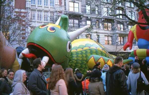 NEW YORK-NOV 21: On the day before the 2012 Macy\'s Thanksgiving Day Parade, all of the giant balloons are inflated with helium. Pictured here are the Flying Dragon and Kool Aid Kid balloons.